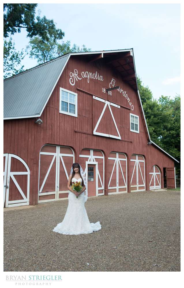 Ashley's Arkansas Bridal Portraits at Magnolia Gardens in front of barn