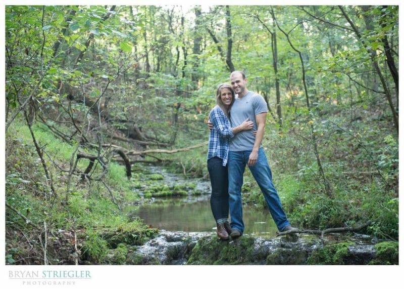 Arkansas Engagement Photos hugging in creek
