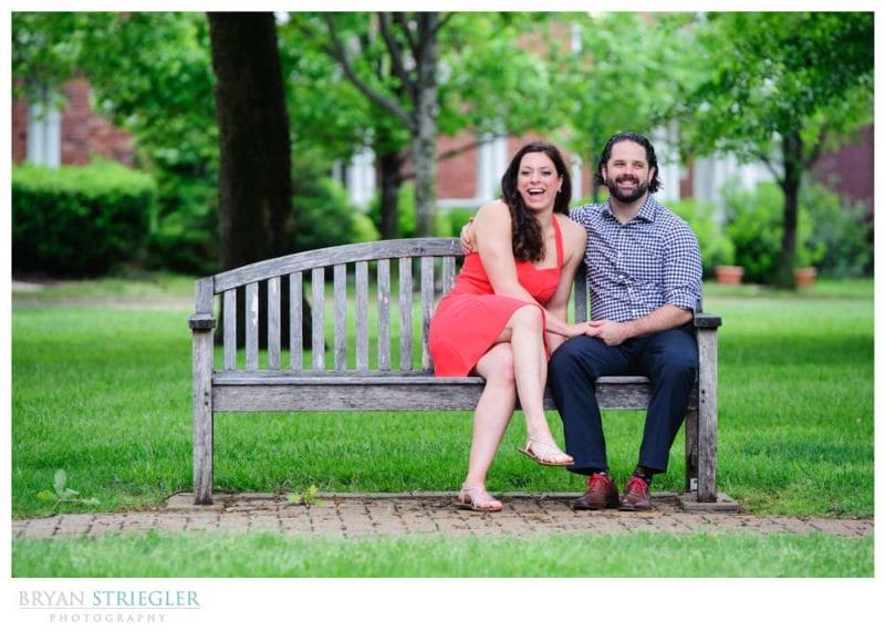 Arkansas Crossfit Engagement Photos laughing on bench