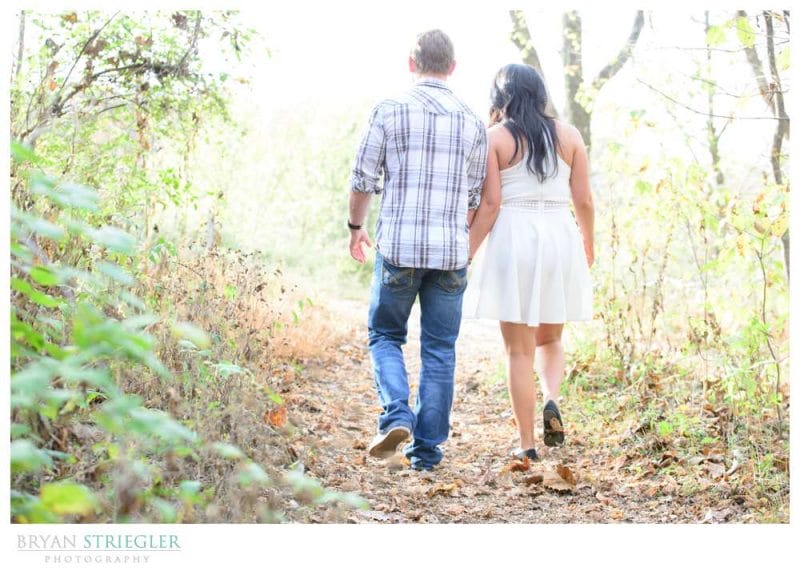 walking away holding hands engagement pictures