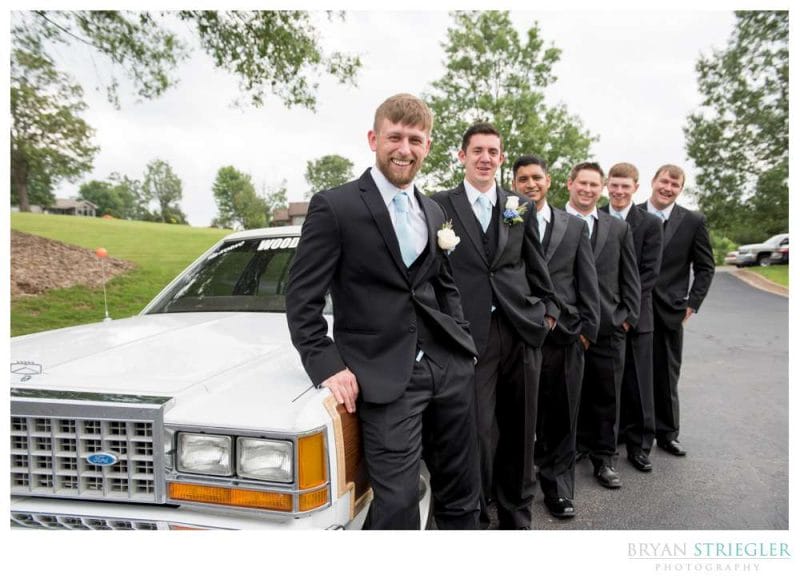 groomsmen with station wagon