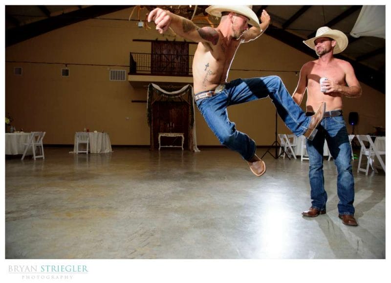 cowboys jumping and dancing at wedding