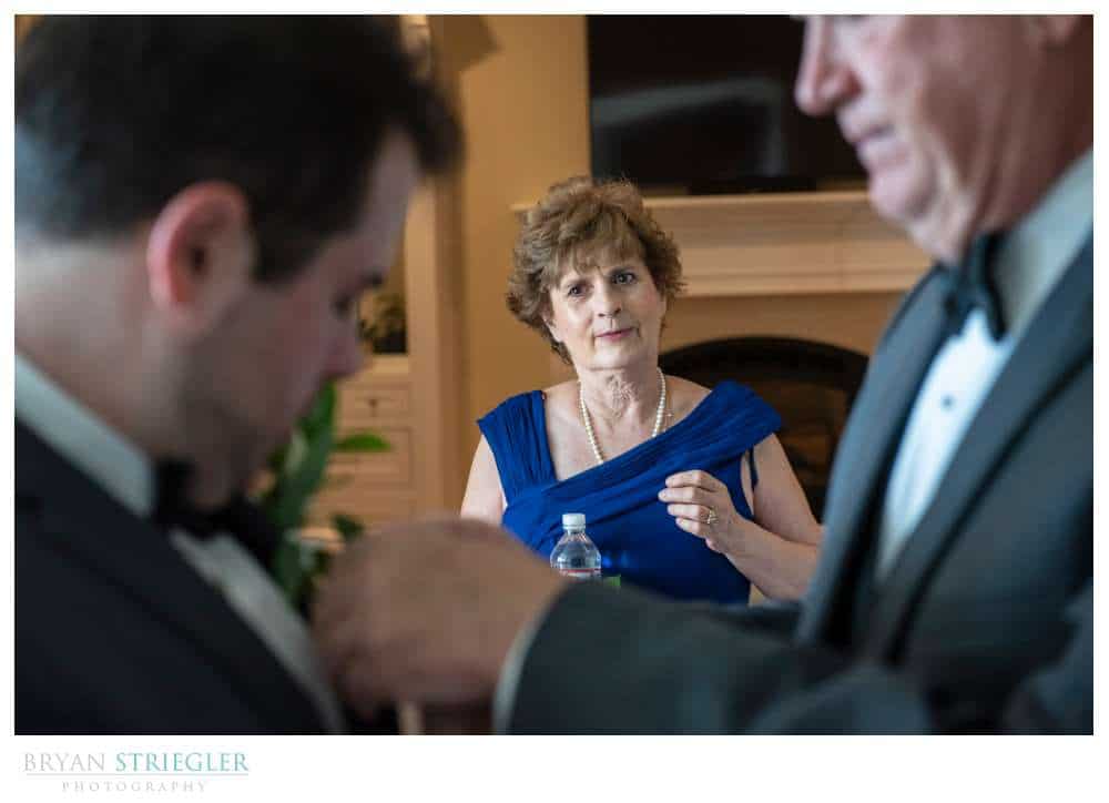 mother watching son at wedding