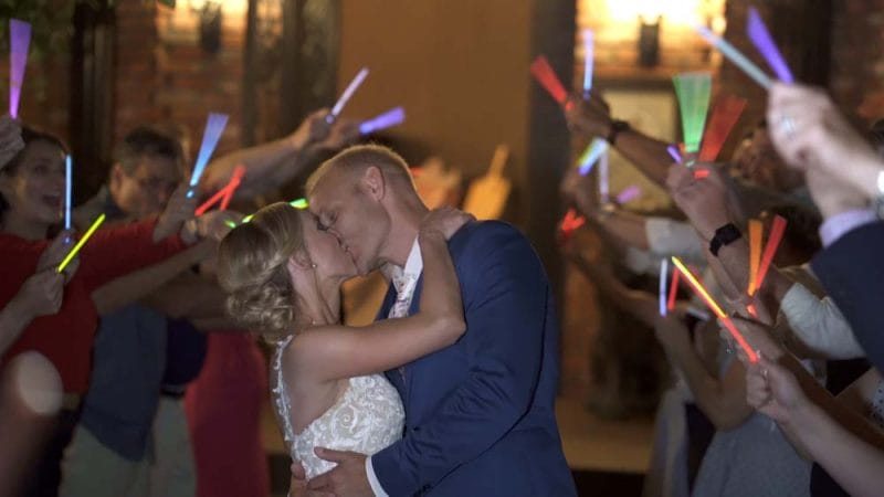 couple kissing after glow stick exit