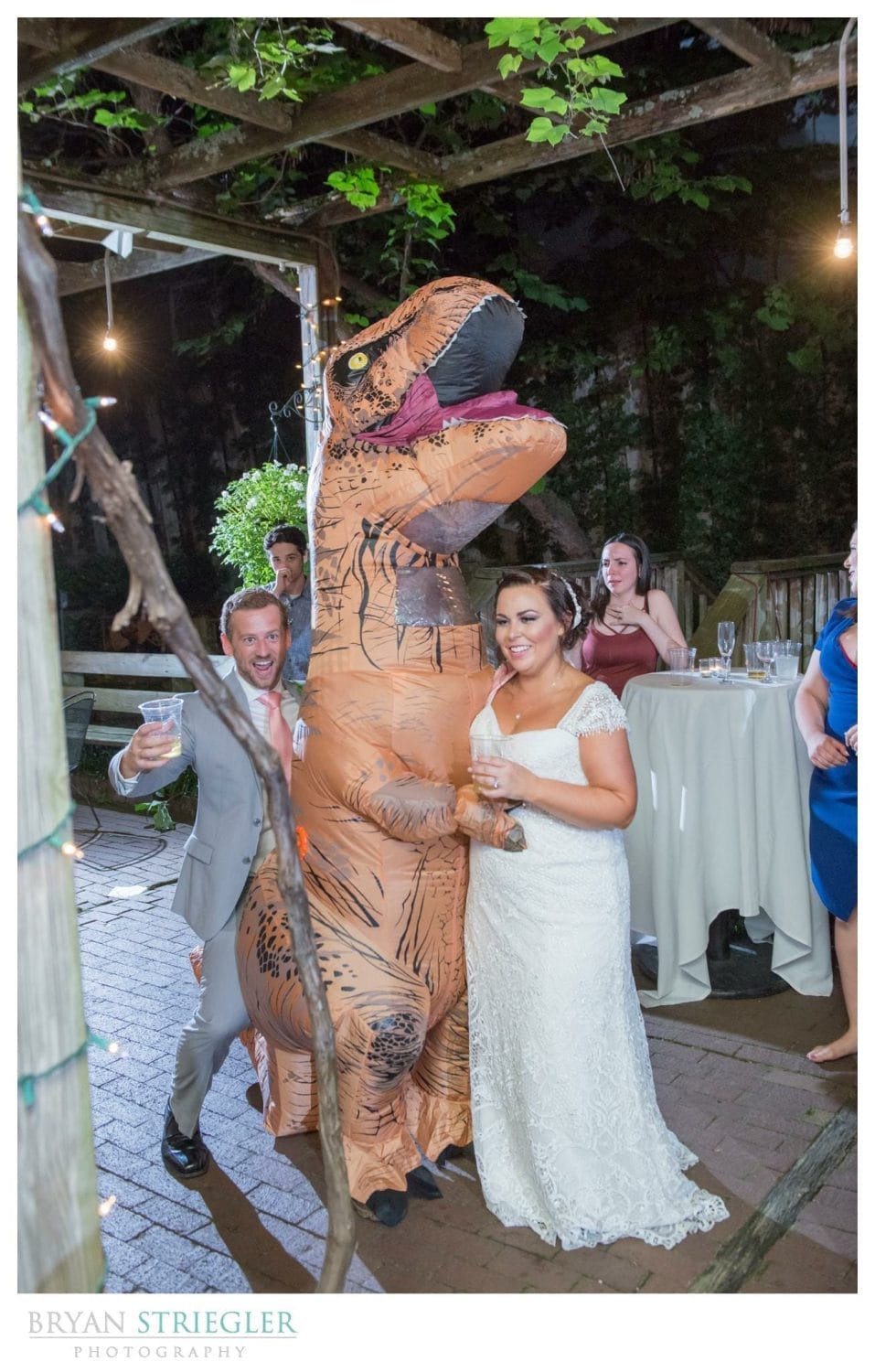 wedding guest in dinosaur costume