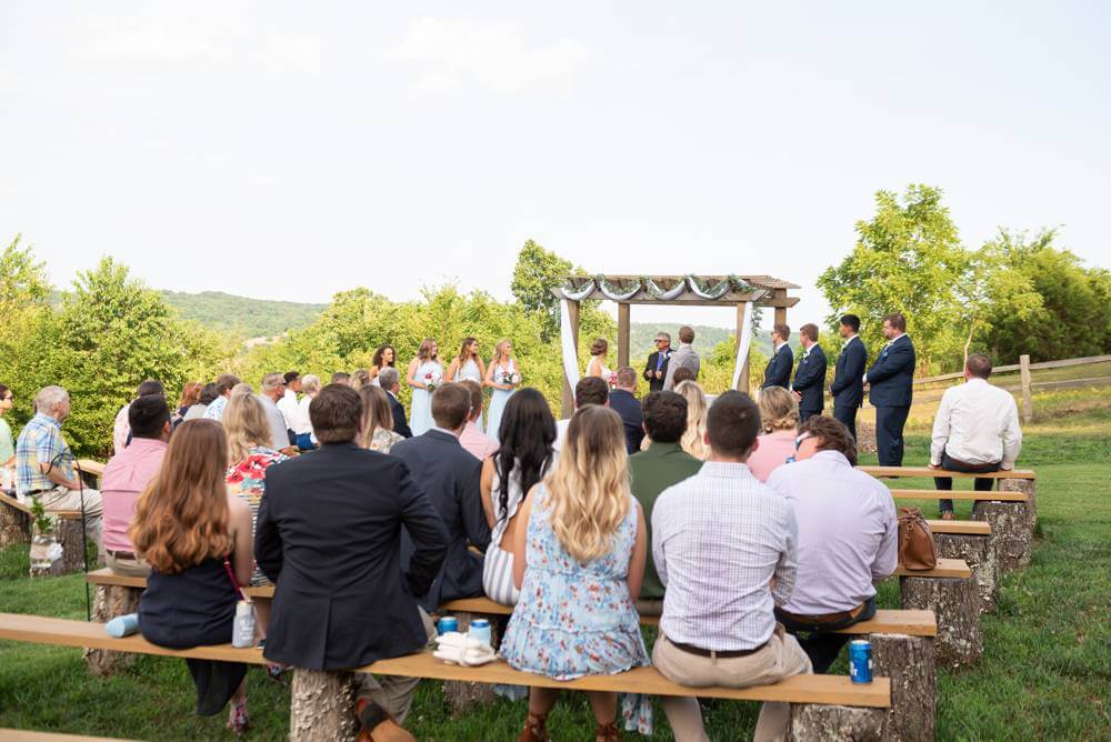 wide shot of wedding ceremony at Under the Woods wedding venue