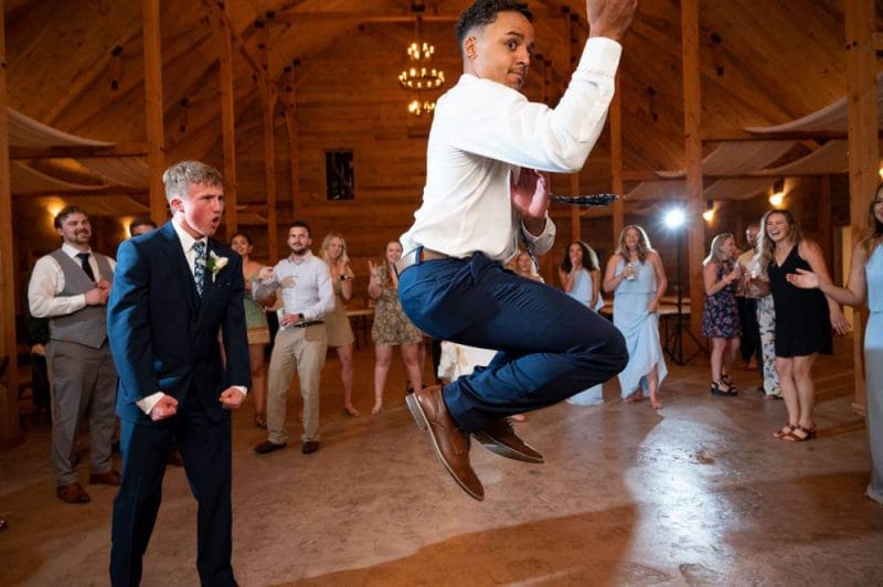 wedding guest dancing and jumping