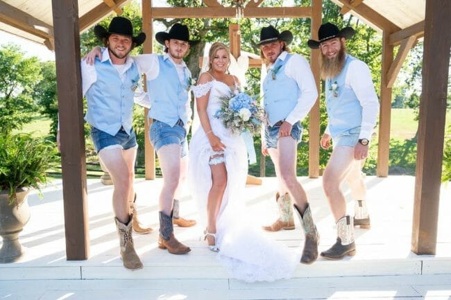 bride and groomsmen showing off legs