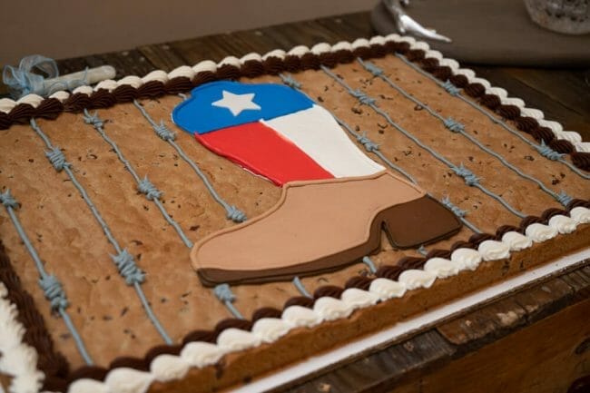 grooms cake with cowboy boot and Texas flag