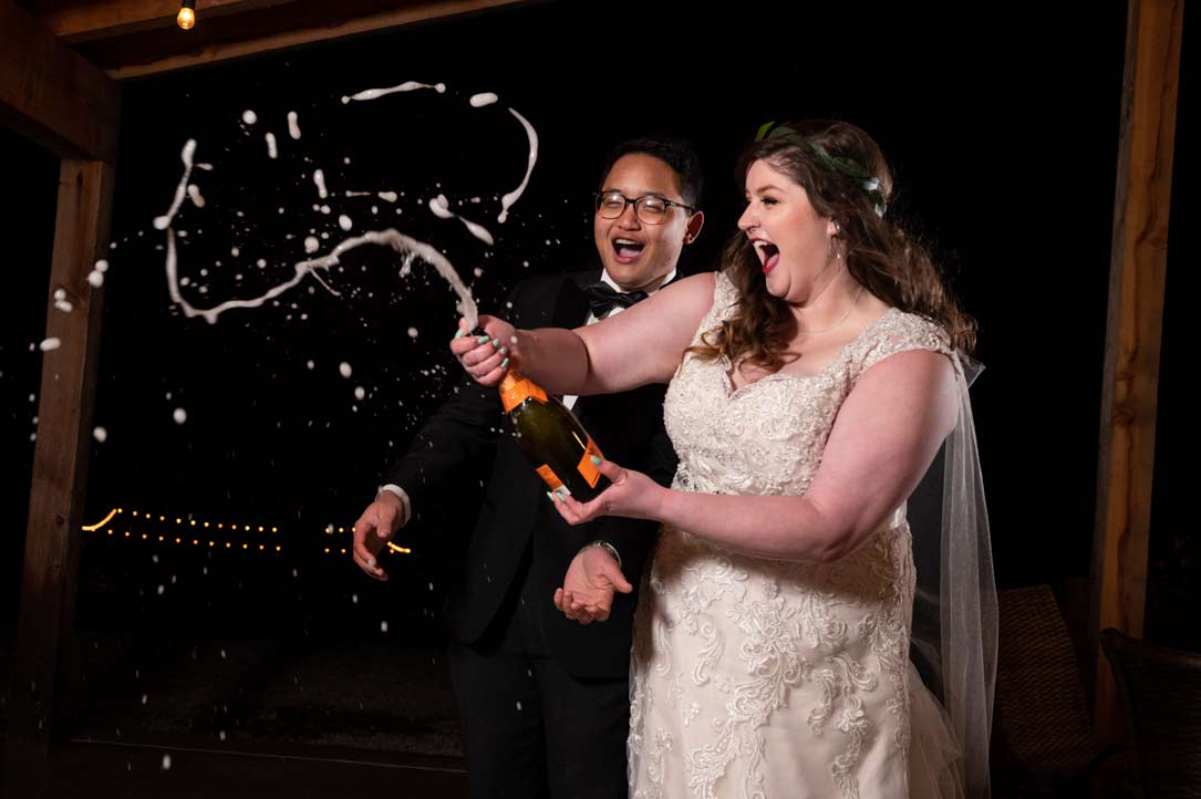 shooting champagne at New Year's Eve wedding