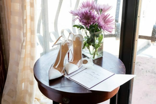 flowers and shoes on table