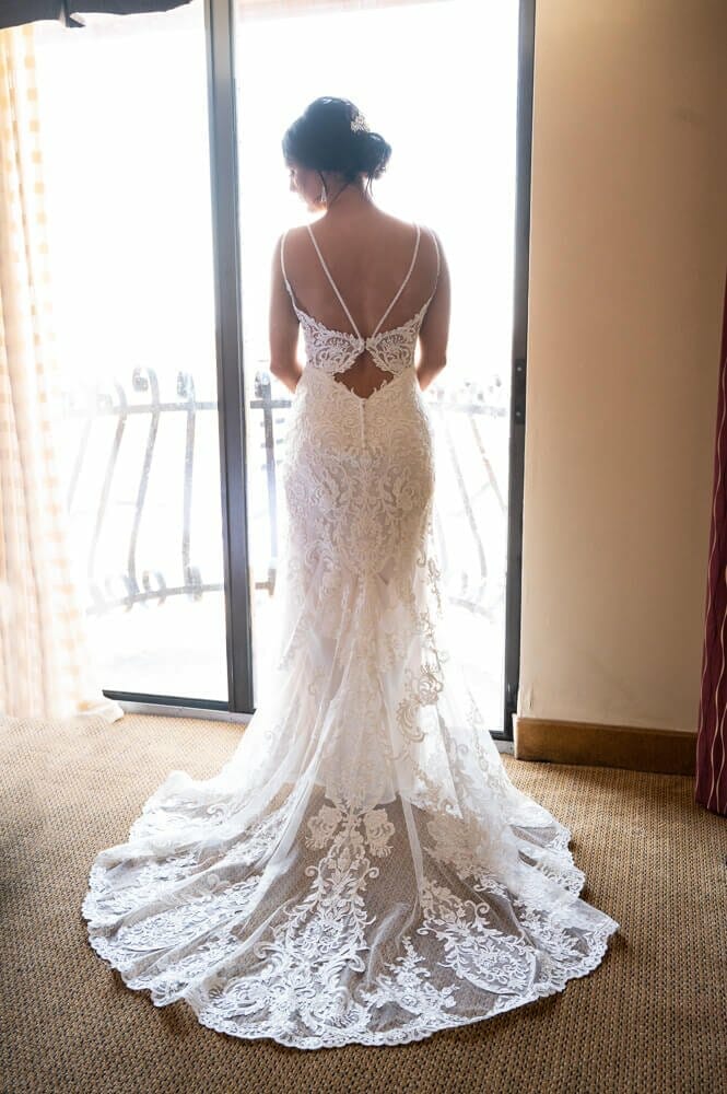 back of wedding dress in front of window