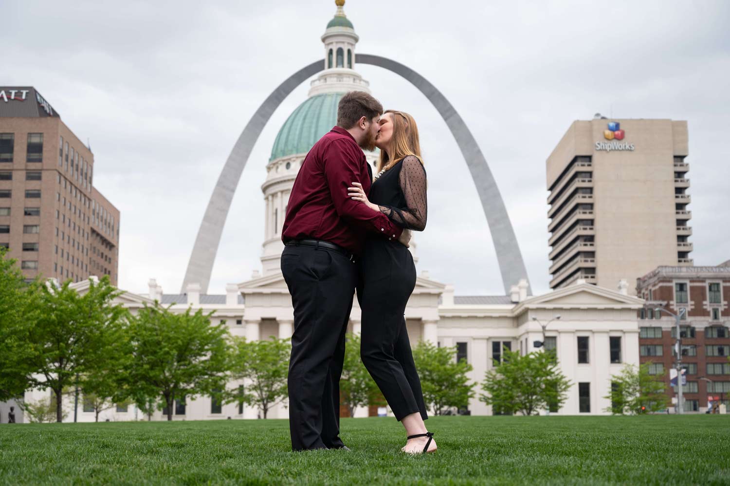 engagement photo at Kiener Plaza in front of St. Louis Arch