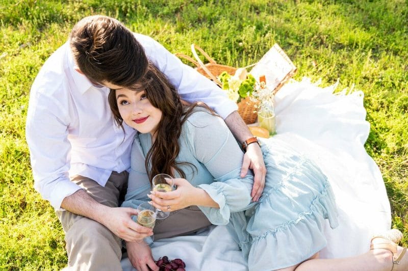 engaged couple at picnic