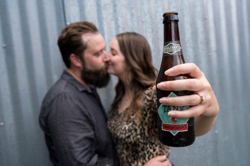 couple holding Boulevard beer during engagement shoot