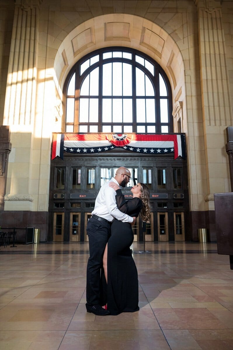 engagement photos in front of entrance to Union Station in Kansas City