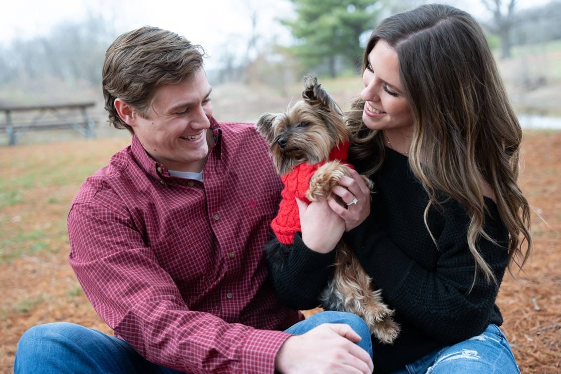 couple with dog during engagement shoot