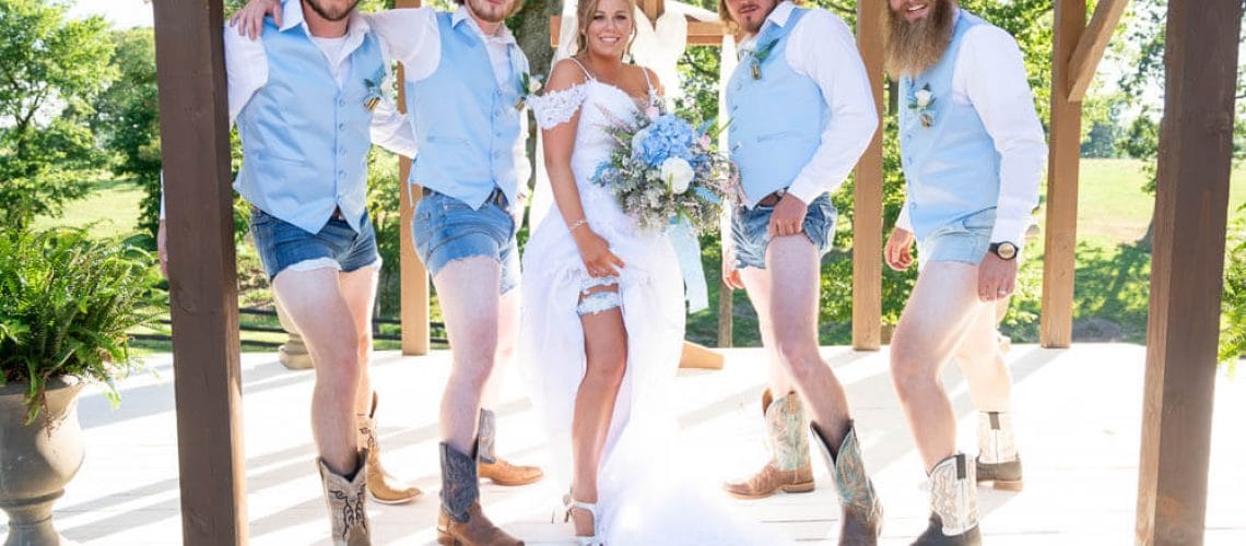 bride and groomsmen showing off legs