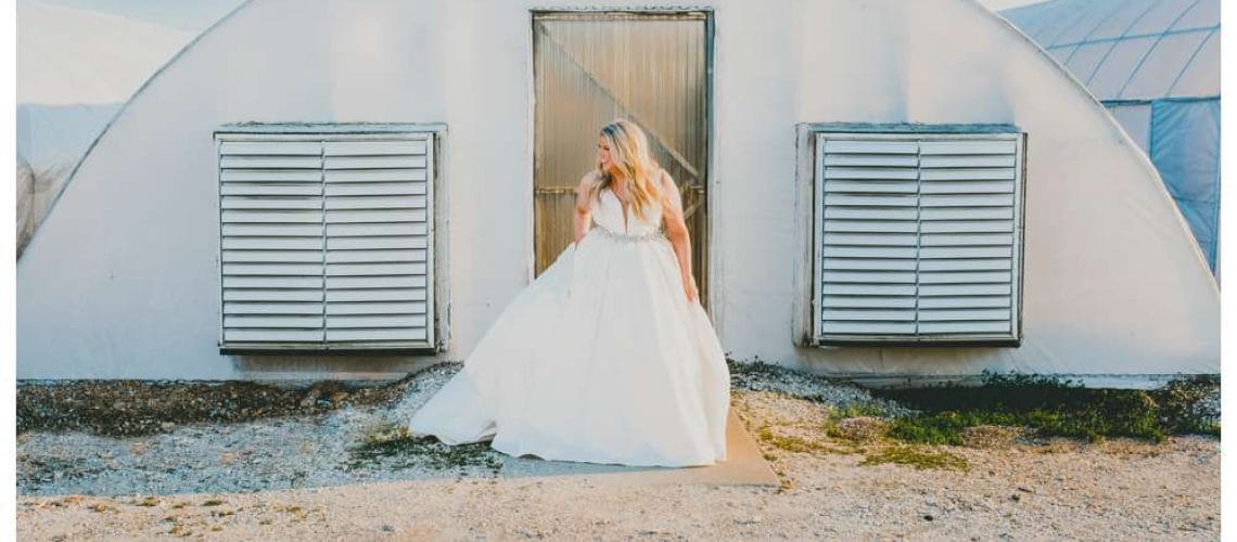 bridal portrait in front of greenhouse