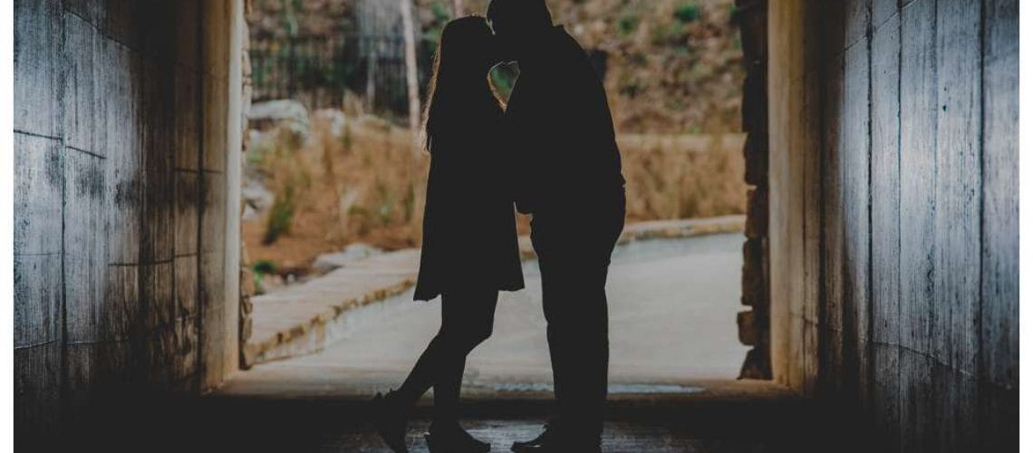 silhouette engagement photo in tunnel
