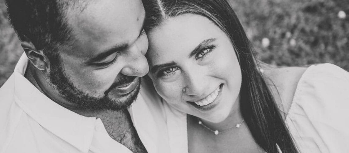 smiling couple at St. Charles engagement shoot